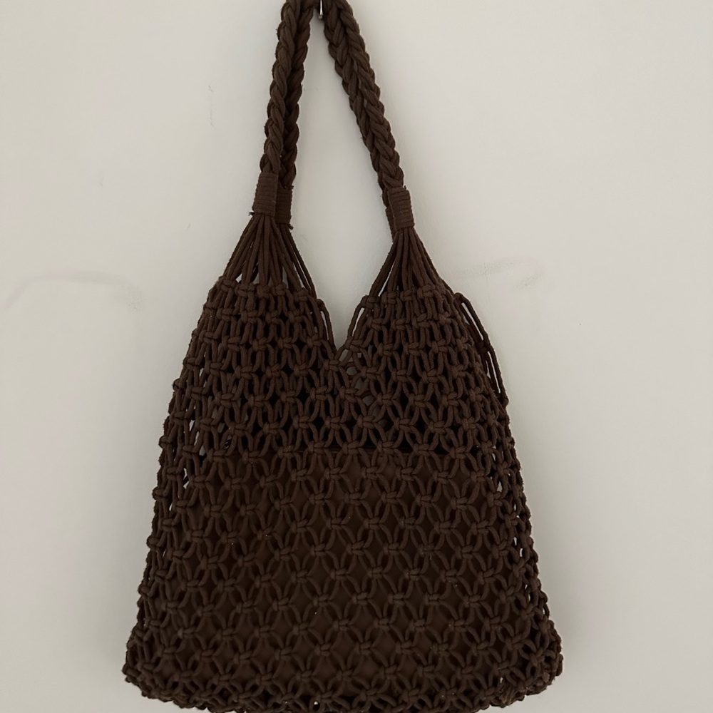 Woven bag with leather pouch that comes with it in brown